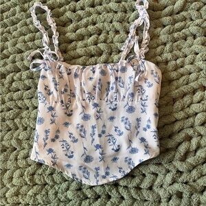 Discreet White Camisole with Blue Floral Print and Ruffled Straps